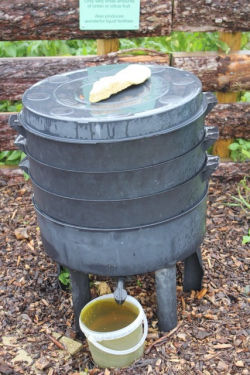 Plastic wormery - consists of 3 circular trays, a lid, and a base with a tap for drainage of liquid. Trays can be lifted out and emptied separately when the compost is ready.